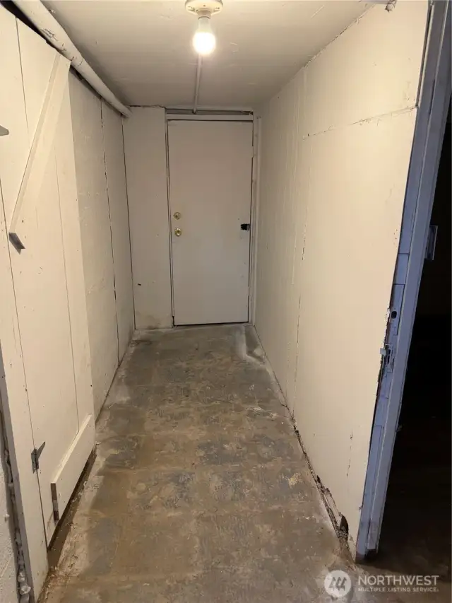 This is a photo of the basement hallway. Each building has a basement that has not been utilized.