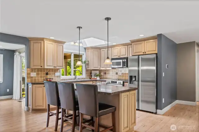 Even the kitchen sink offers views of the sunsets and Sound, making evening clean-up more enjoyable. The skylight further enhances the space by introducing more natural light into the great room.