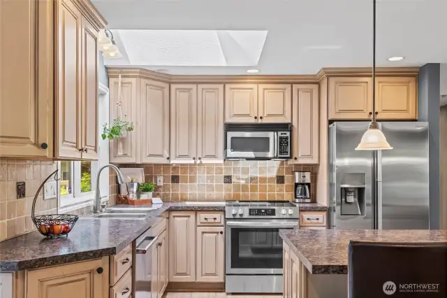 New stainless-steel range/oven and dishwasher were installed in 2024. The full tile backsplash perfectly complements the cabinetry.