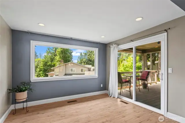 Let's head out the sliding glass door to the 360 sq. ft. Trex deck that has a covered portion and also stairs down to the back yard for easy entertaining.