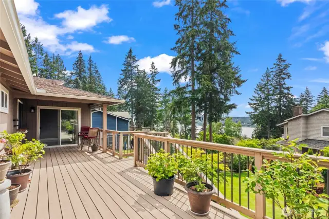 Step outside of the sliding glass door of the primary bedroom with a morning cup of coffee and enjoy this peaceful view.