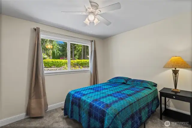 This room, one of the two additional bedrooms on this floor, features a generous closet, new carpeting, and modernized trim and doors.