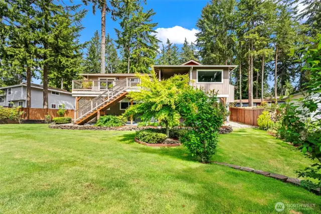 Beautifully landscaped, this fully fenced 0.31-acre property provides ample space for recreation and fun. To the right of the house there is added covered storage area for all your outdoor equipment needs.