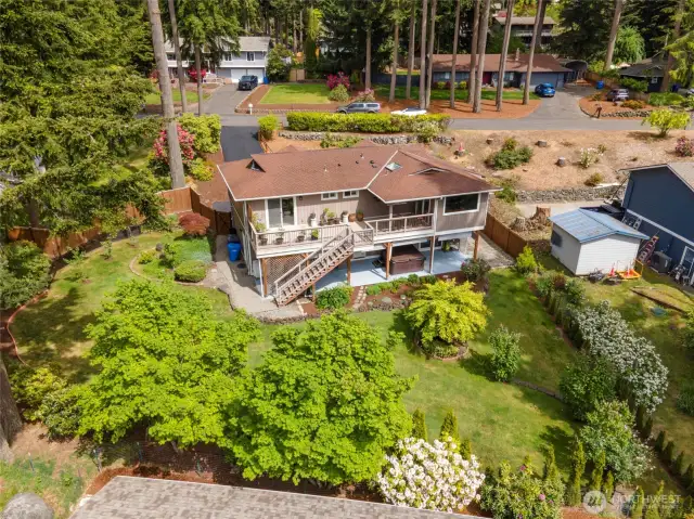 This showcases the established landscaping as the colorful foliage starts to bloom.
