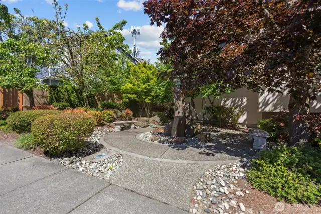 There is easy to find off-street parking for your guests when they come to visit!  There is also this great little spot to sit while you are enjoying being outside.