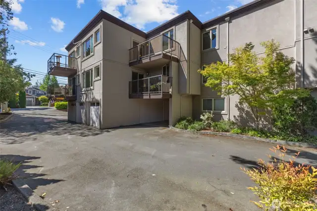 203 Balcony pictured (center top of picture).  You can see it is recessed from the neighboring balcony allowing for added privacy.