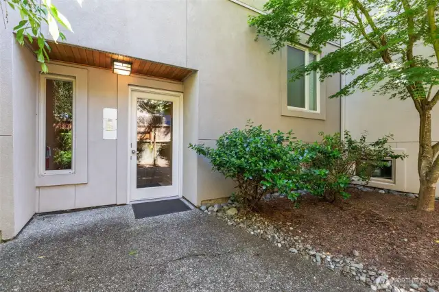 I love the serenity of the short walk from the street parking to the secured access door; it has lovely plants along the walk.  The garage is under the building and is shared with only 2 other homes.