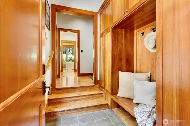 Mudroom connecting hallway nearest secondary bathroom and vestibule to the upper bedroom/bonus room.  Poolis to the right in the hallway shown.
