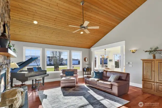 Soaring vaulted ceilings, a cultured stone rocked gas fireplace, south facing windows to watch the planes come and go!