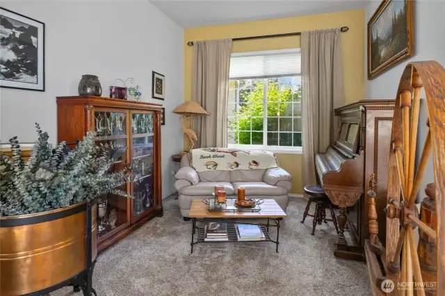 Extra sitting area off the front entry and living room views out to the front yard.