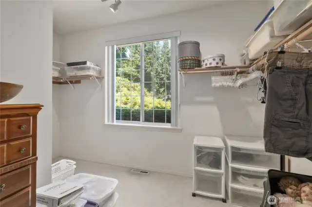 Walk in closet in primary suite.