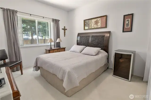 Bedroom three neutral colors in here and views looking into the side yard, lots of light in here.