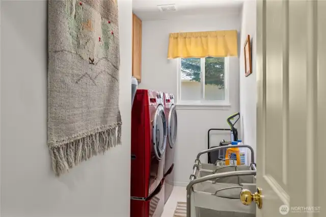 Laundry room right off the garage entrance and next to the two bedrooms, washer/dryer stays.