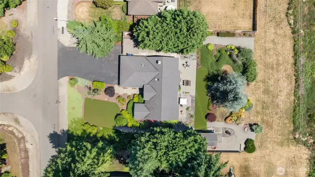 Overhead view of the home and ALL of the property almost AN ACRE!!!! Beautifully maintained and gorgeous landscaping with tons of room for parking and entertaining.