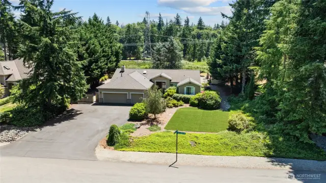 Front view of home and notice the side yard very private with mature landscaping.