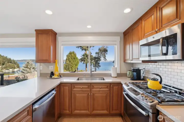 Quartz countertops are durable, stylish and practical. The color of the cabinets and counters is easy to personalize your decor around. It is nice to have a gas cook top for chef-quality cooking.