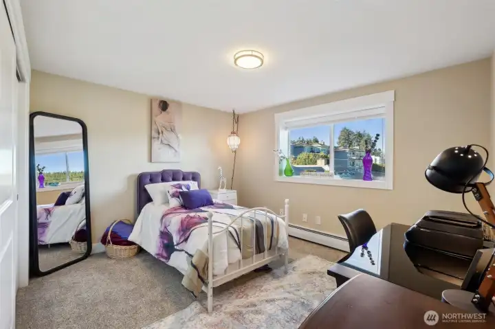 Natural light floods the room. OR shut the white wide blinds for privacy.