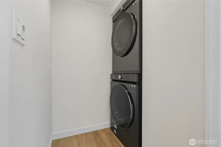 Equipped with Samsung high-efficiency washer and dryer for modern convenience and energy savings.
