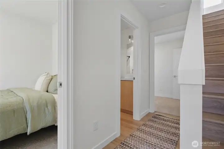 Welcoming first-level hallway that provides easy access to bedrooms.