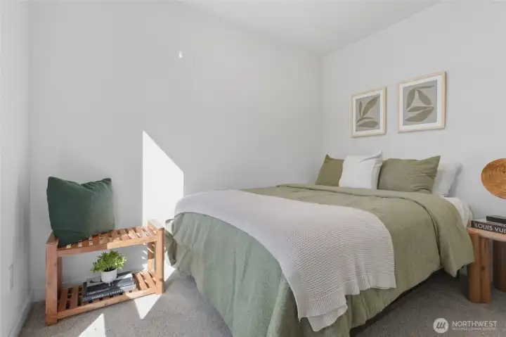 Bright first-level bedroom offering comfort and privacy, ideal for guests or multi-generational living.