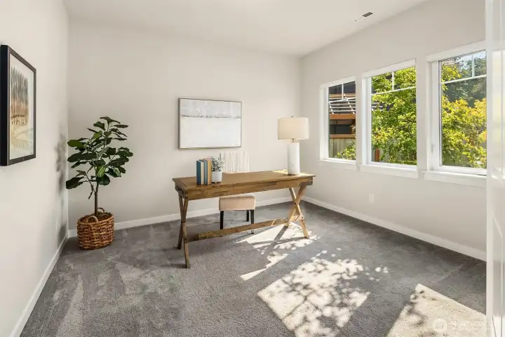 As you step inside the home the first room on your right is a large office with light-filled windows. Enclosed by double doors, it's the perfect WFH space.