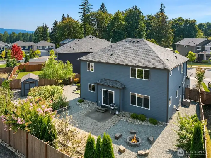 Aerial view of back exterior and back yard.