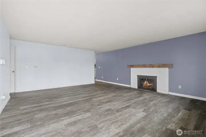 Front living room w/ wood burning fireplace