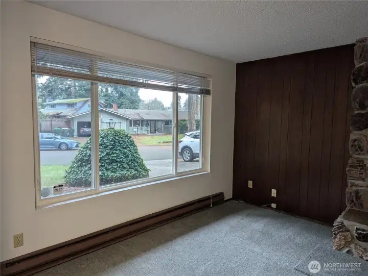 The day light from this picture window gives this room lots of sunshine!