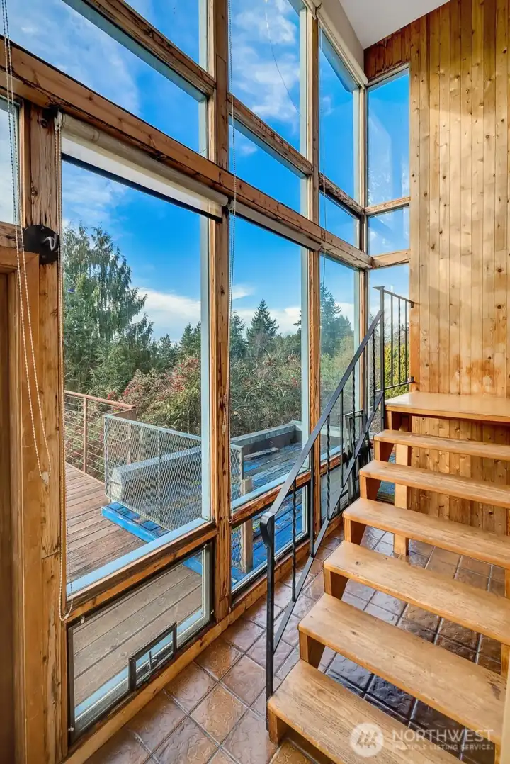 Staircase leading to upper open loft space.