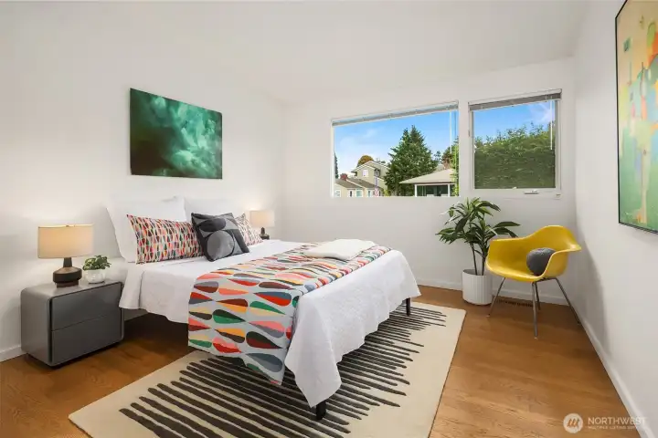 One of two additional main-floor bedrooms, both very gracious in scale with large closets and north-facing windows.