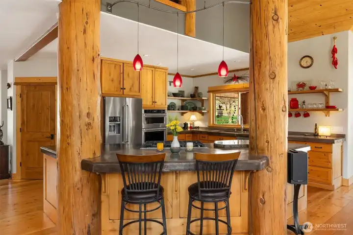 Bar seats beckon in the open concept Great Room