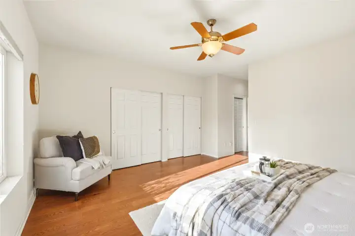 Primary suite retreat with ensuite soaking tub and walk-in closet.