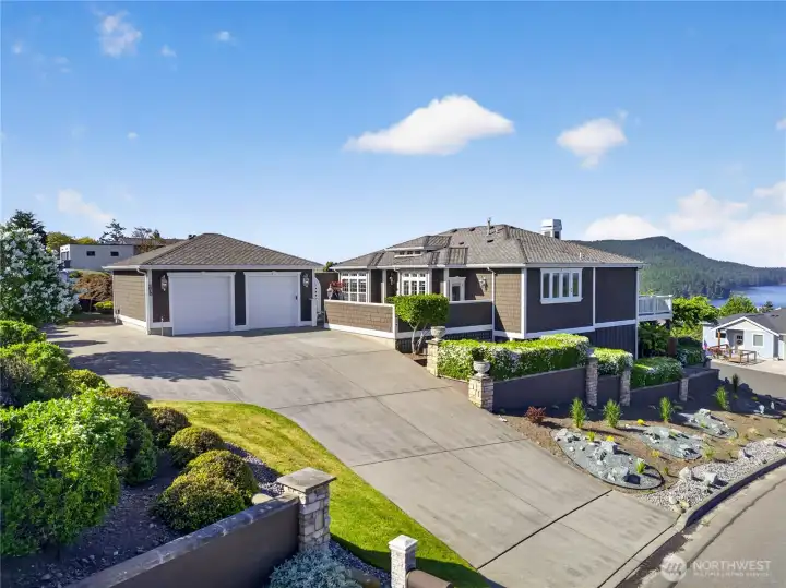 Detached 2-car garage. Thoughtful and expertly designed landscaping surrounds the property.