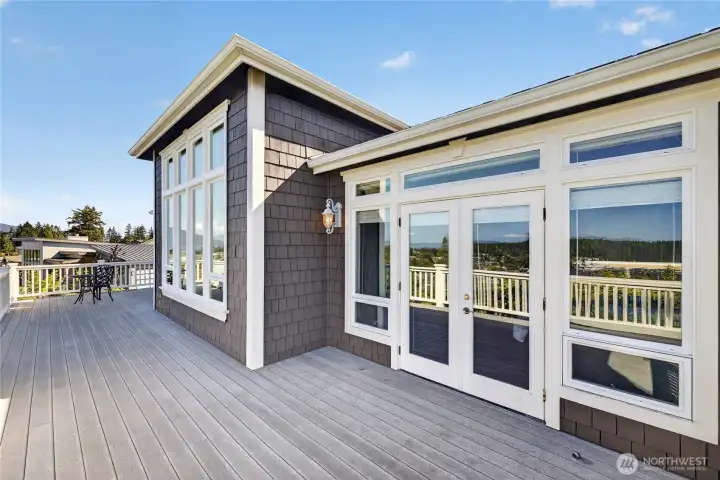 Ample room for entertaining. French doors to the deck from the dining room and the primary bedroom.