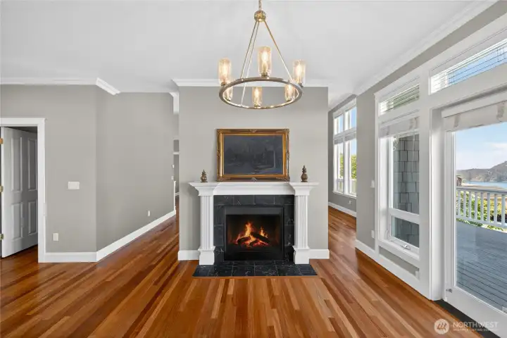 The fireplace is two-sided. Enjoy it from the dining room and the living room, a great feature for guests flowing about the great room to enjoy the view.