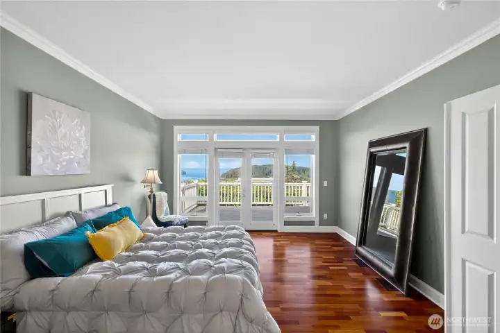The primary bedroom also has the view and French Doors out onto the deck.
