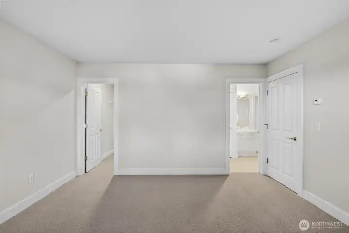Brand new carpet in the lower level bedrooms. The doors lead to the family room, ensuite bathroom and walk-in closet.