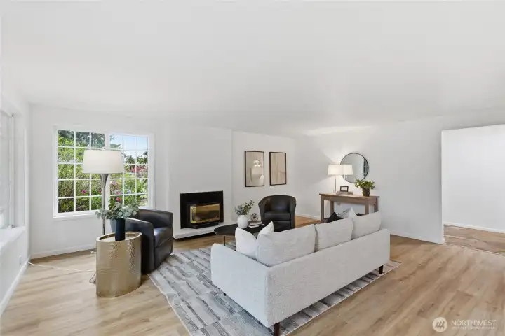 Third perspective showcases the room's depth and flow, vaulted ceiling line, and the seamless connection to adjacent spaces.