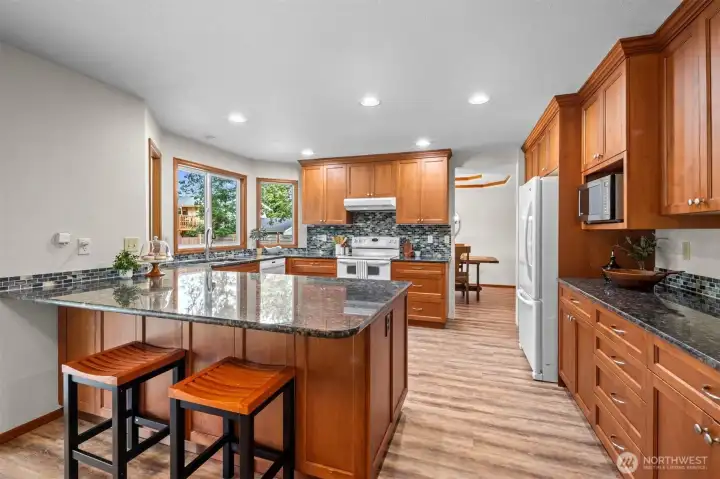 Wow! Look at all the counter space. And a breakfast bar works great for homework time too!