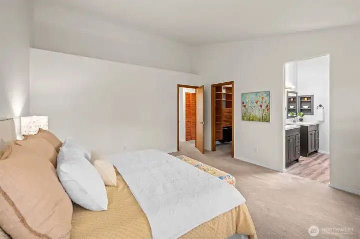 Primary suite with 5 piece bath and custom built walk-in closet.
