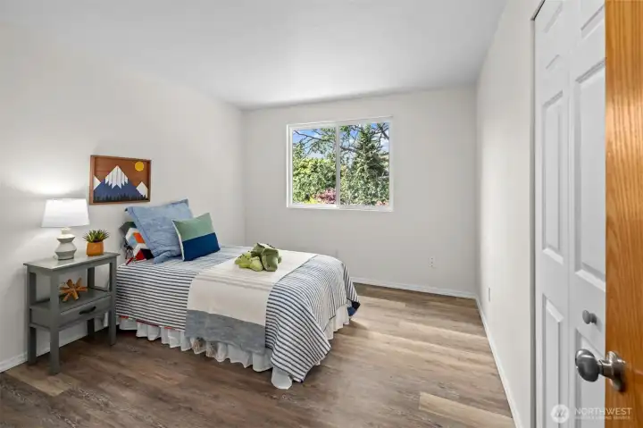 Just one of the bright bedrooms with a peaceful view.