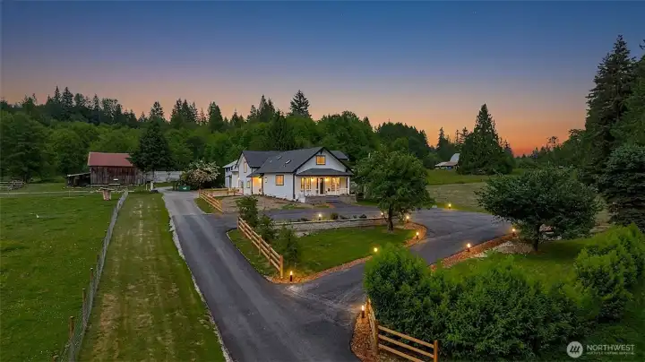 Beautiful Farmhouse Charm meets Modern Luxury. Newly added wraparound asphalt driveway, with in ground lighting and mature fruit trees/ landscape.