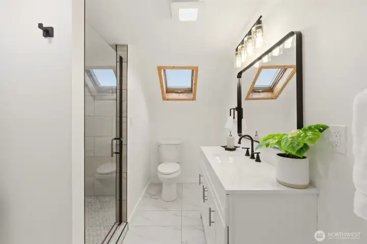 Beautiful new vanity and walk in, tiled shower.