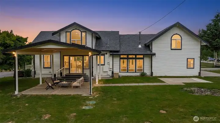 Back side of the home with a beautiful covered patio.