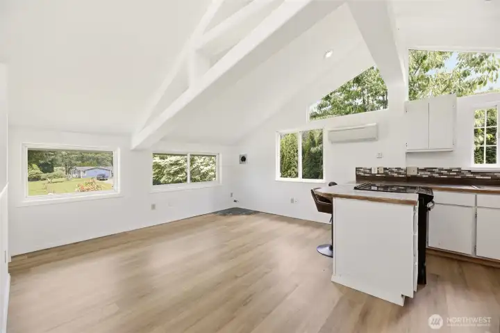 The vaulted ceiling and windows all around make this space feel light and bright.