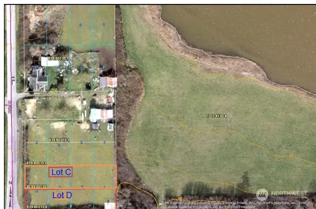 Broad/Macro aerial of the location of the two lots for sale, C & D. Lagoon to the NorthEast and pasture to the East