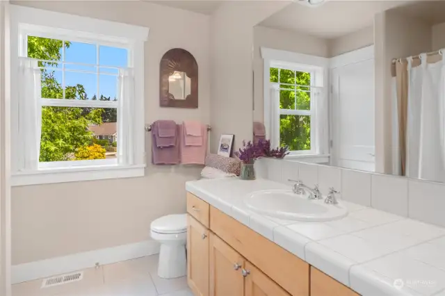 Upstairs full bath with a tub/shower.