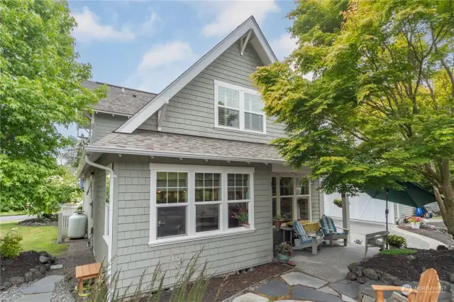 Back of the home with a covered porch off the dining area.