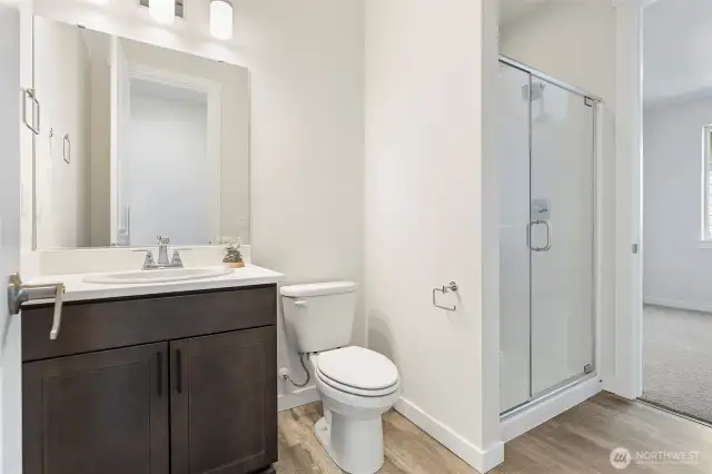 Main floor 3/4 bath adjacent to guest suite. Layout will be slightly different. Pics not of actual home, but similar floorplan and may contain upgrades.