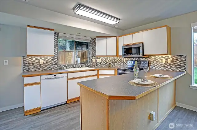 The kitchen features high end appliances including this Bosch Dishwasher. All the cabinets are ready to load your kitchen goodies and have been cleaned professionally.